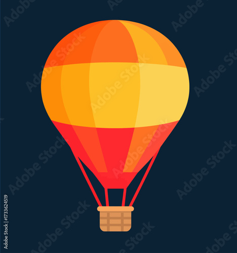 Vibrant hot air balloon floating against dark sky at night
