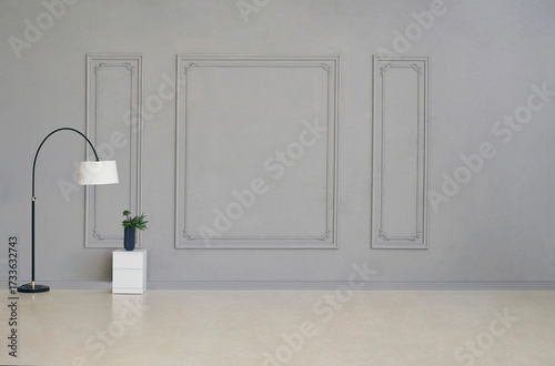Minimalist bedroom with modern bed, white bedding, stylish chair, arc floor lamp, potted plant, and elegant wall design.