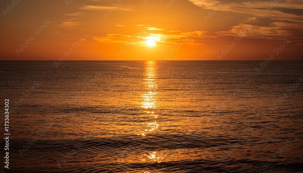 Obraz premium Beautiful Sunset Over Calm Ocean Water Reflecting Golden Light With Warm Hues And Peaceful Atmosphere Du Twilight