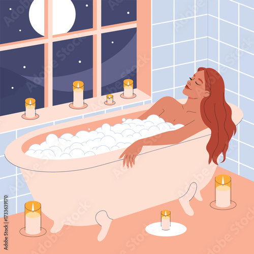 Woman relaxing in a bubble bath surrounded by candles at night bathtub bubbles
