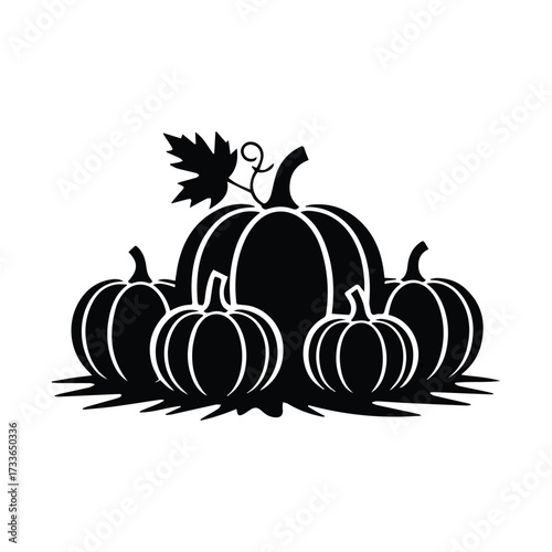 Group of assorted size pumpkins and autumn leaf silhouette for fall harvest decoration silhouette