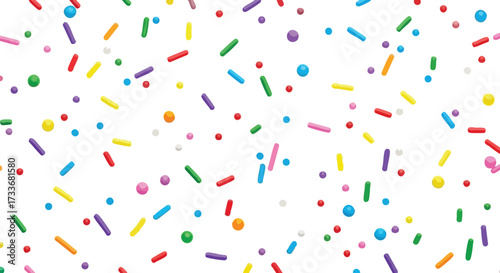 Colorful sprinkles background with various shapes and colors scattered on a white surface.
