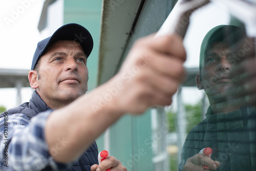 close view of man cleaning windows