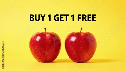 Buy One Get One Free Promotion with Two Red Apples on Vibrant Yellow Background, Retail Marketing Offer