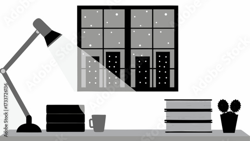 A desk with a lamp illuminating books and a mug next to a window showing a cityscape at night time