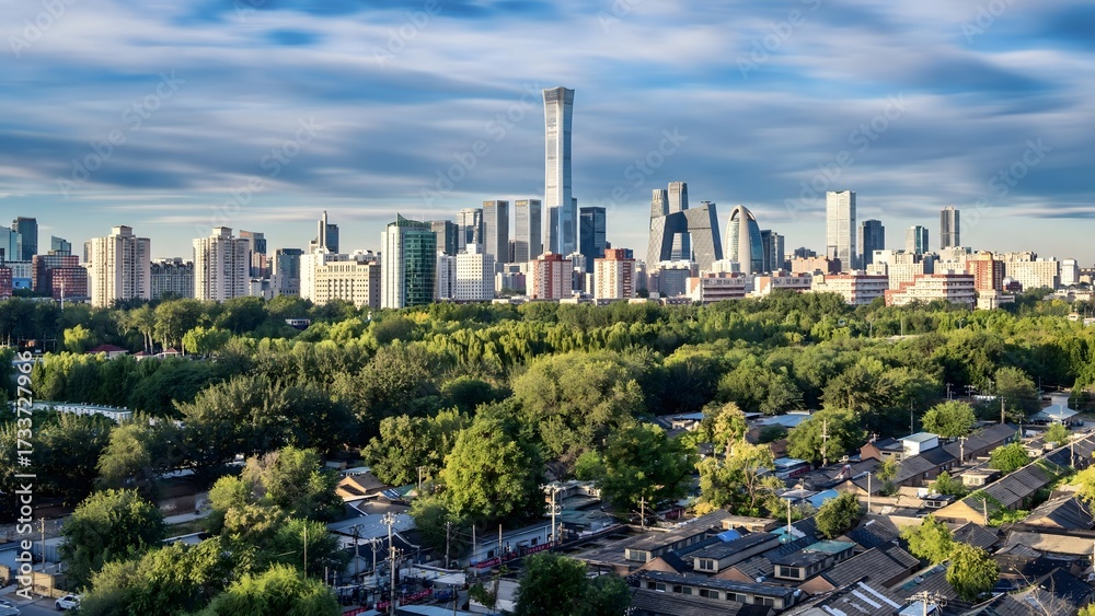 Fototapeta premium Beijing Modern Cityscape with Green Parkland and Residential Neighborhoods Under Cloudy Sky
