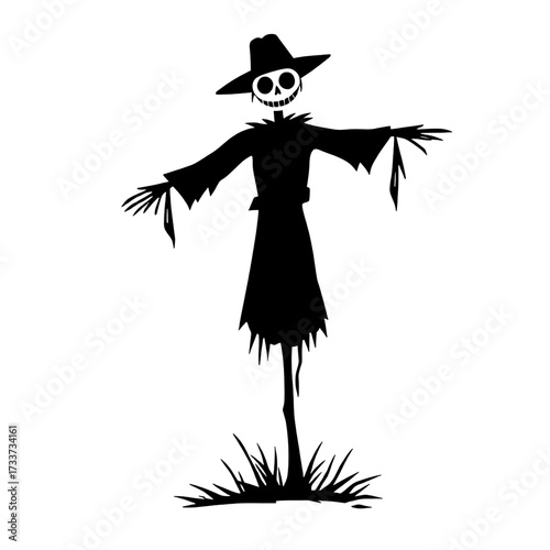 spooky scarecrow silhouette in a field of grass