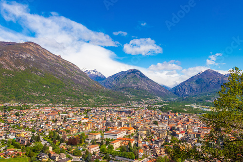 Aerial view of small town of Domodossola in Ossola valley surrounded by green Alps in Piedmont, Italy
