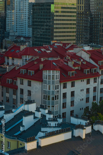 Warsaw skyscrapers between Żelazna Street and Grzybowska Street with residential rooftops in the foreground