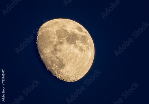 Aerial view of the moon's serene glow, the cratered surface in stark relief against the inky expanse, a celestial dance of light and shadow, Space.