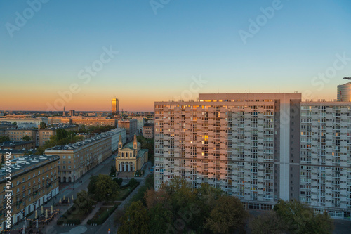 Warsaw Wola district – Za Żelazną Bramą estate with high-rise residential blocks and church on Chłodna Street at sunset