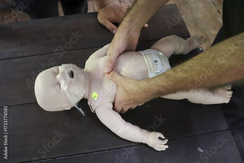 Quadro su tela Infant CPR training demonstration showing gentle chest compressions for resuscit