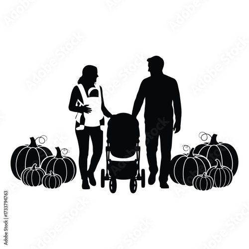 Family with stroller enjoys pumpkin patch amongst harvest pumpkins 