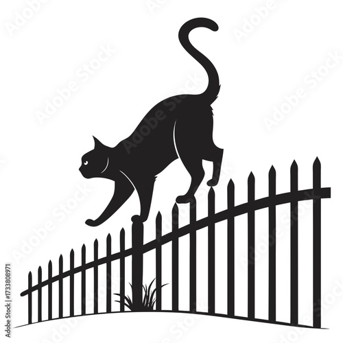 Black cat silhouette arching back on a picket fence