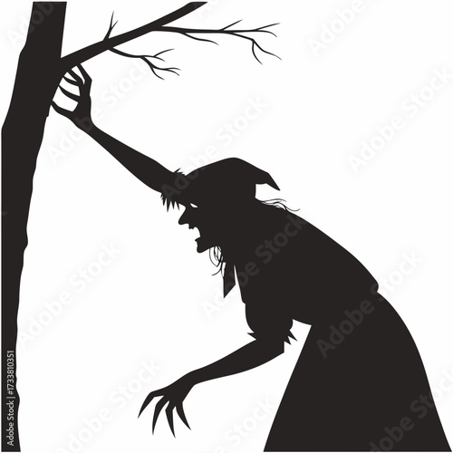 Black silhouette of a witch reaching for a tree branch