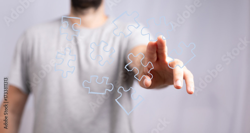 Businessman connecting puzz...