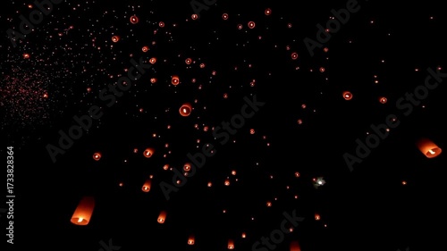 Lanterns fill the sky as they float gracefully in the air. Many paper lanterns are released into the night sky to commemorate a certain day.