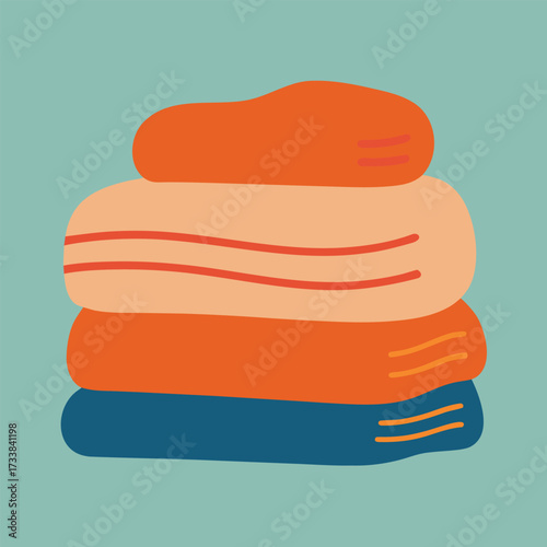 A stack of neatly folded colorful towels in orange and blue hues
