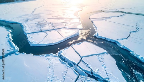 Aerial drone view of a vast frozen sea breaking apart, revealing the dark water beneath the cracked ice, a powerful visual of climate change's impact on the planet