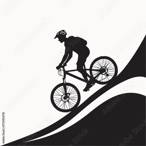 Black silhouette of a mountain biker descending a slope