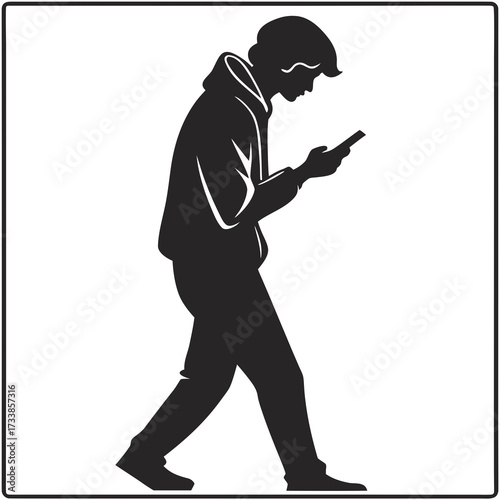 Black silhouette of a person walking and looking at a smartphone