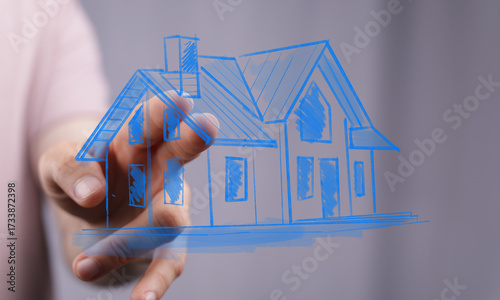 A hand holding a sketched h...