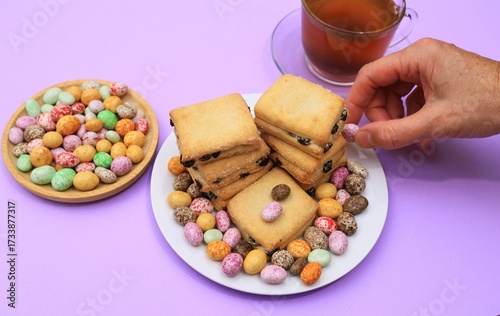 hand holding a bowl of cookies