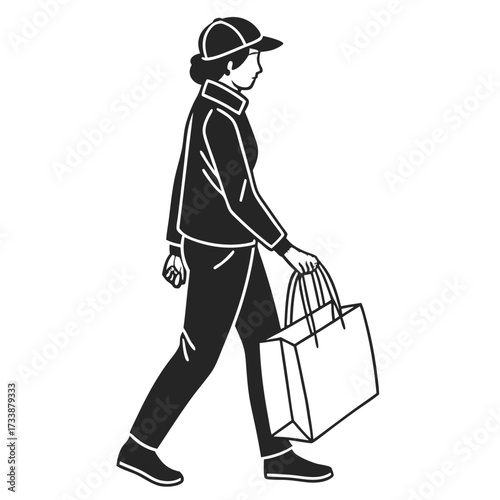 Woman in cap walking with shopping bag carrying