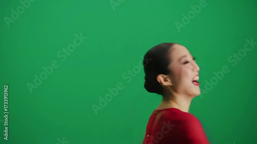 Joyful Woman Laughing Energetically on a Green Screen Background