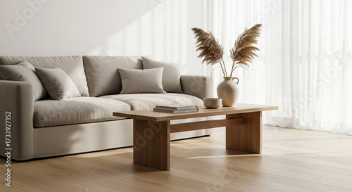 Elegant living room with a modern sofa and wooden coffee table.