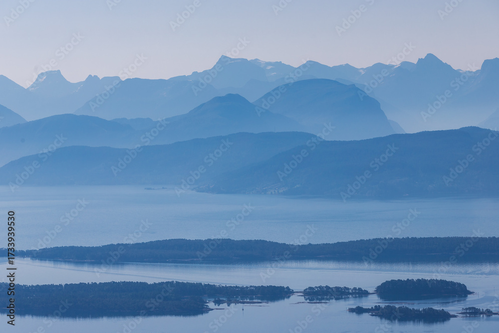 Fototapeta premium A fantastic view rom the Varden viewpoint over the Norwegian town of Molde, the fjord with the many islands and the famous panorama with over 220 peaks with most mountain tops over 1000 meters high