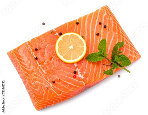 Raw salmon fillet with lemon and herbs