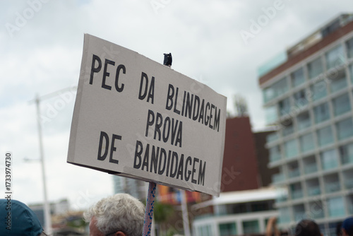 Brazilians are seen with signs during a protest against a bill that protects corrupt individuals in Brazil. Salvador, Bahia.