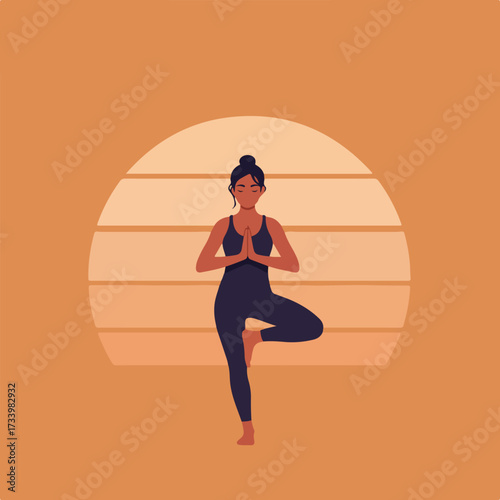 Woman in tree pose against a striped sunset