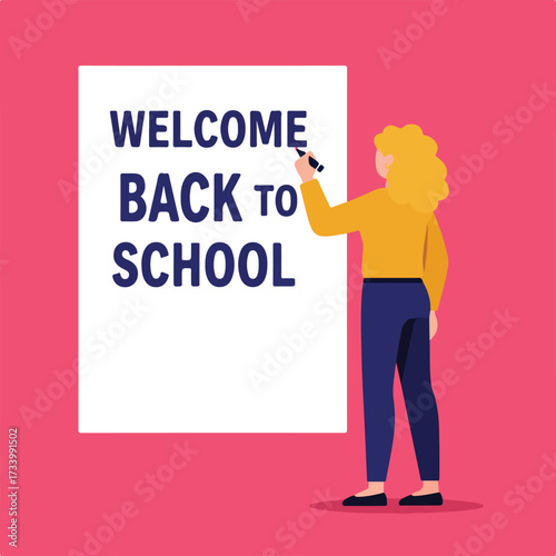 A person writes "WELCOME BACK TO SCHOOL" on a large poster