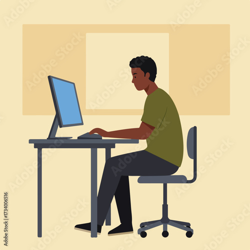 Young man working on computer at desk