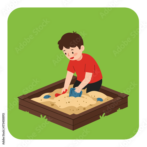 Child playing in sandpit with shovel and bucket, green background