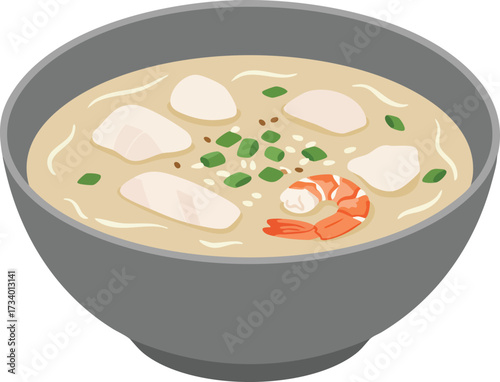 A gray bowl of creamy seafood soup containing pieces of fish, a shrimp, and garnished with chopped green onions.