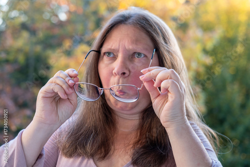 Tableau sur toile Amazed woman stares in shock, eyes wide open, bulging eyes, expressing disbelief