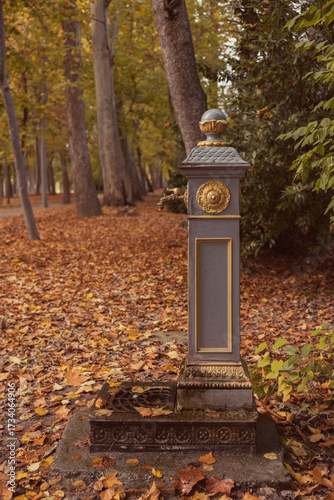 Close-up of ornate rusted iron water fountain.
