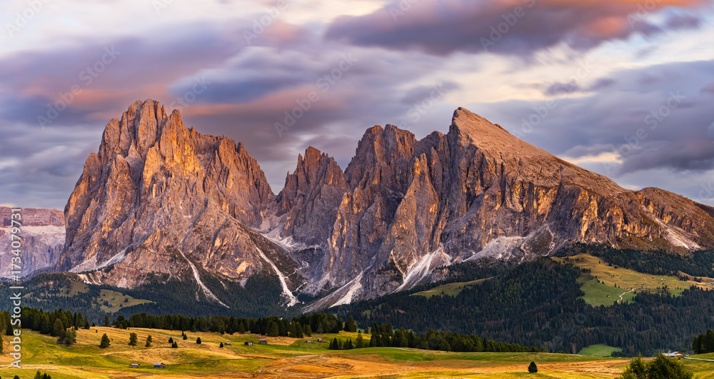 Fototapeta premium The UNESCO site Seiser Alm or Alpe di Siusi the Dolomite plateau and the largest high-elevation Alpine meadow in Europe located in Italy's South Tyrol province in the Dolomites in autumn sunset.