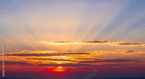 Vibrant Sunset Sky with Sun Rays.