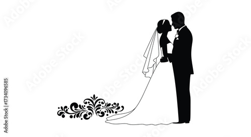 Romantic couple in wedding attire embracing tenderly in a dark silhouette