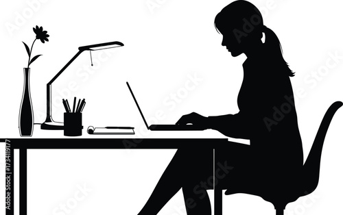 Silhouette of woman working at desk with laptop, lamp, flower vase, notebook, and pen holder in modern study setup.