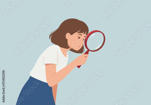 Investigating details with a magnifying glass indoor setting focused viewpoint curiosity concept