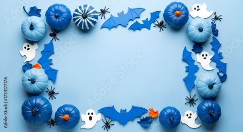 Blue halloween frame with pumpkins bats and ghosts on a light blue background flat lay design