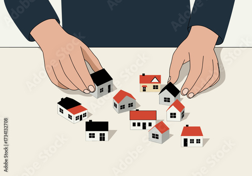 Arranging miniature houses for real estate planning home office creative workspace overhead view housing concept