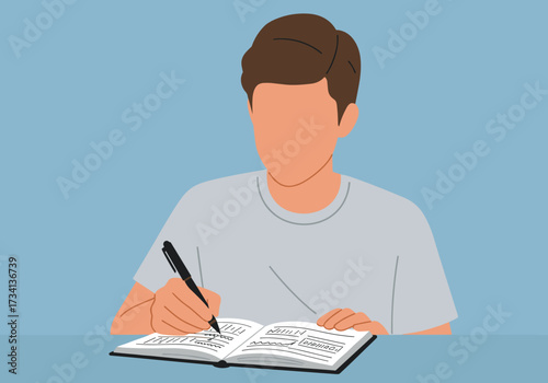 Studying with purpose student engaged in note-taking indoor workspace digital focused environment side view