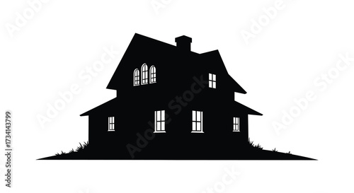 Dark outline of a haunted house on a small hill silhouette
