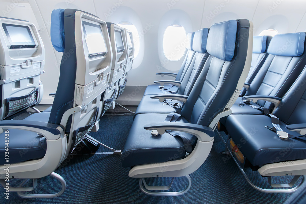 Fototapeta premium Blue economy class seats inside a widebody aircraft at Viracopos Airport, Brazil, on September 16, 2022.